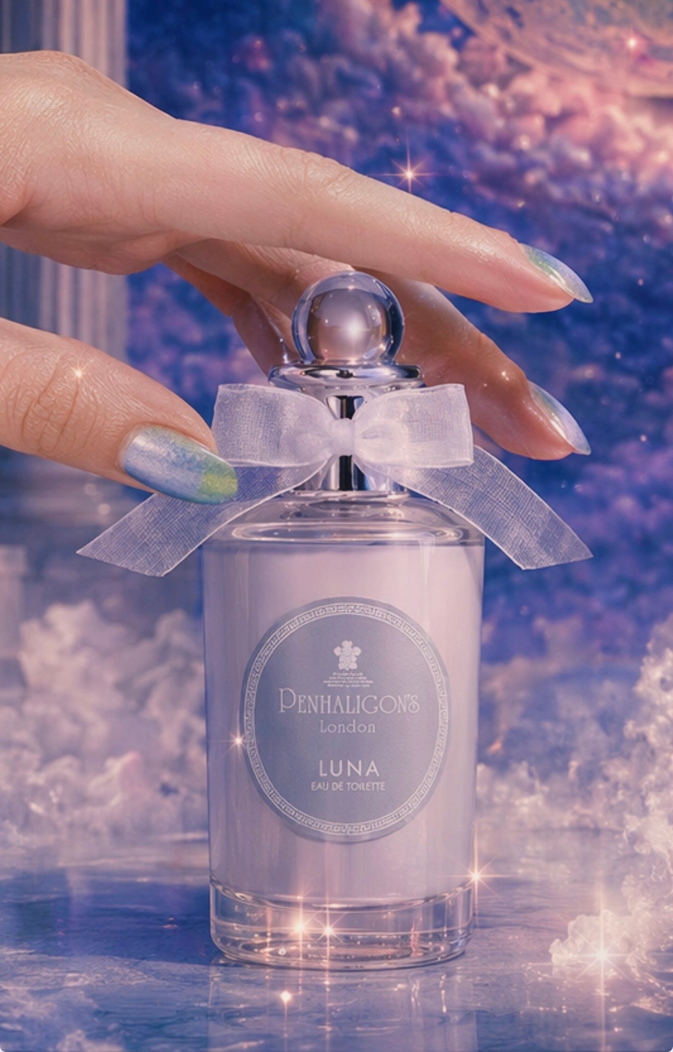 Luxury fragrance campaign photography featuring Penhaligon’s Luna perfume surrounded by celestial clouds, moonlit colours and dreamlike beauty styling